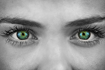 Closeup of a Womans Green Eyes