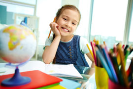 Kid Reading At Her Desk