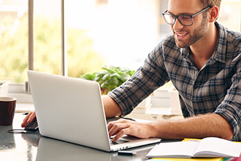 Closeup of Man on Laptop