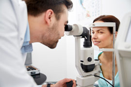 Male Doctor Performing an Eye Exam on a Patient