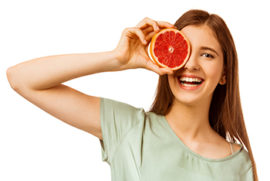 Woman Holding a Grapefruit on Her Eye